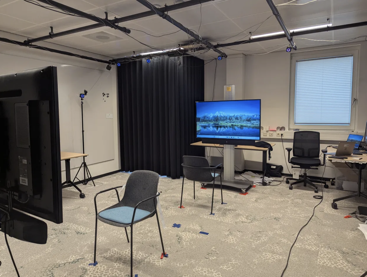 Interaction Lab at University of Twente with 14 OptiTrack cameras and black curtains