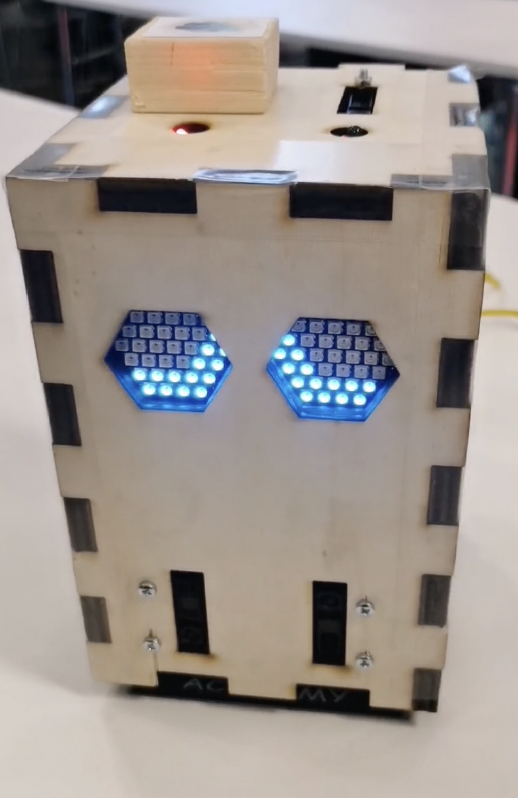 SAM Challenge 2 prototype with blue LED eyes showing apologetic state